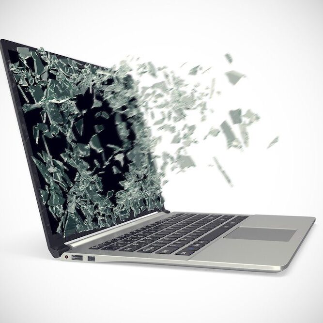 Modern metal laptop with broken screen isolated on white background.