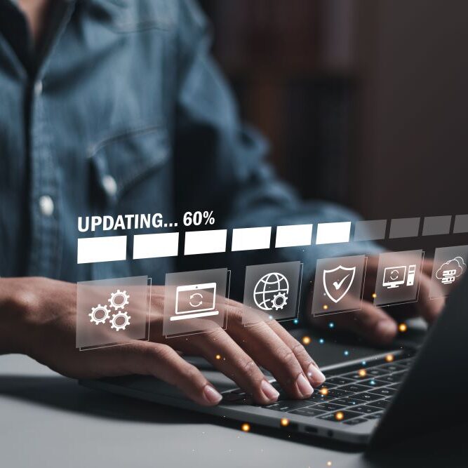 A man updating his computer to the latest software upgrade.